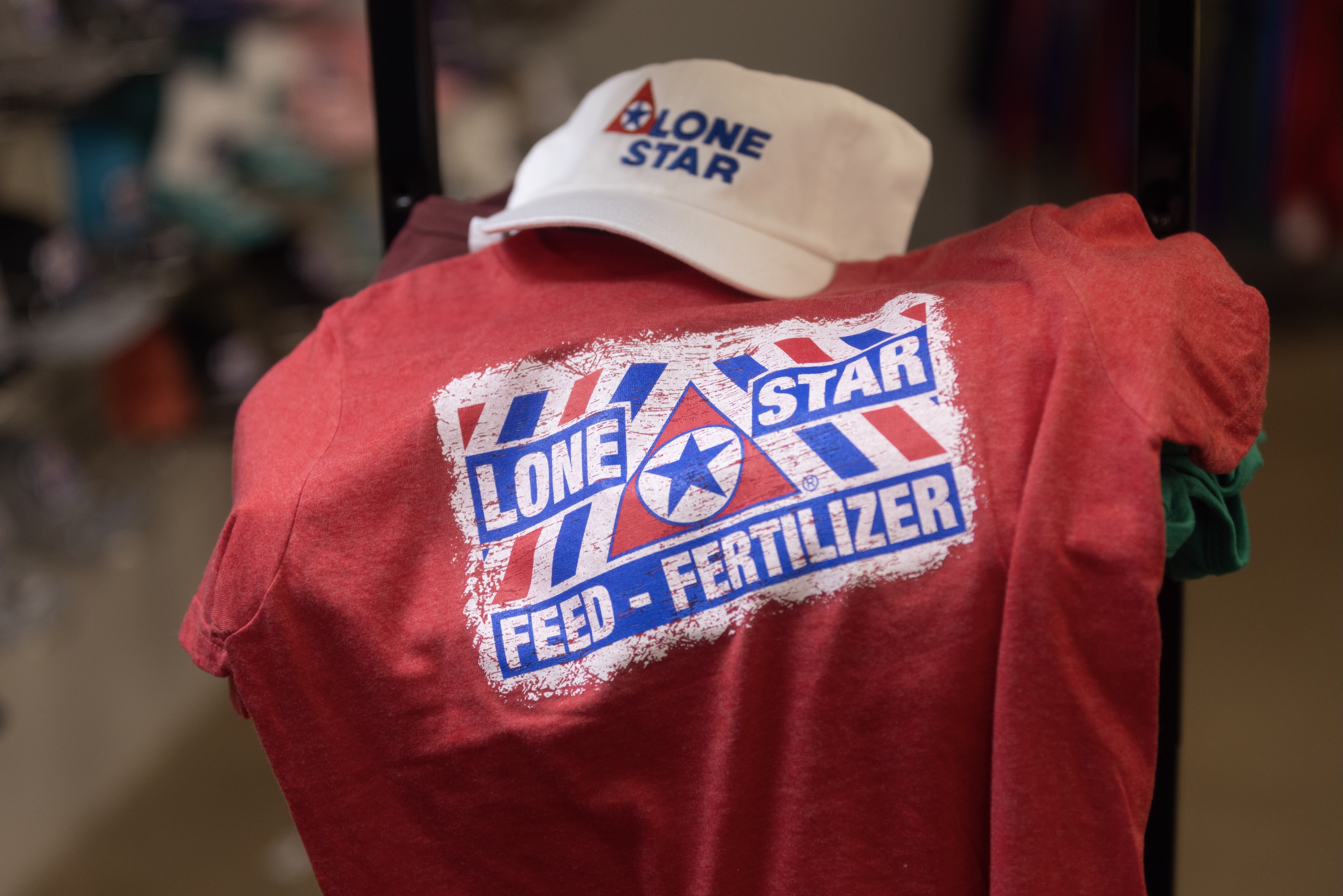 Lone Star Feed & Apparel Red TShirt and Beige Hat with branding