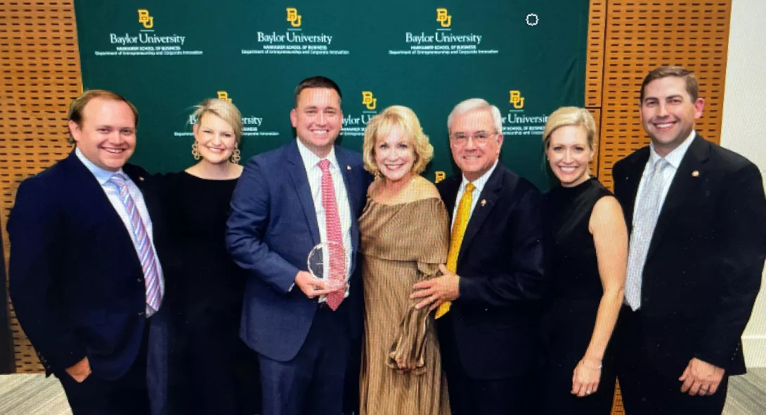 TFP Nutrition honored as family business of the year - family and company members holding award