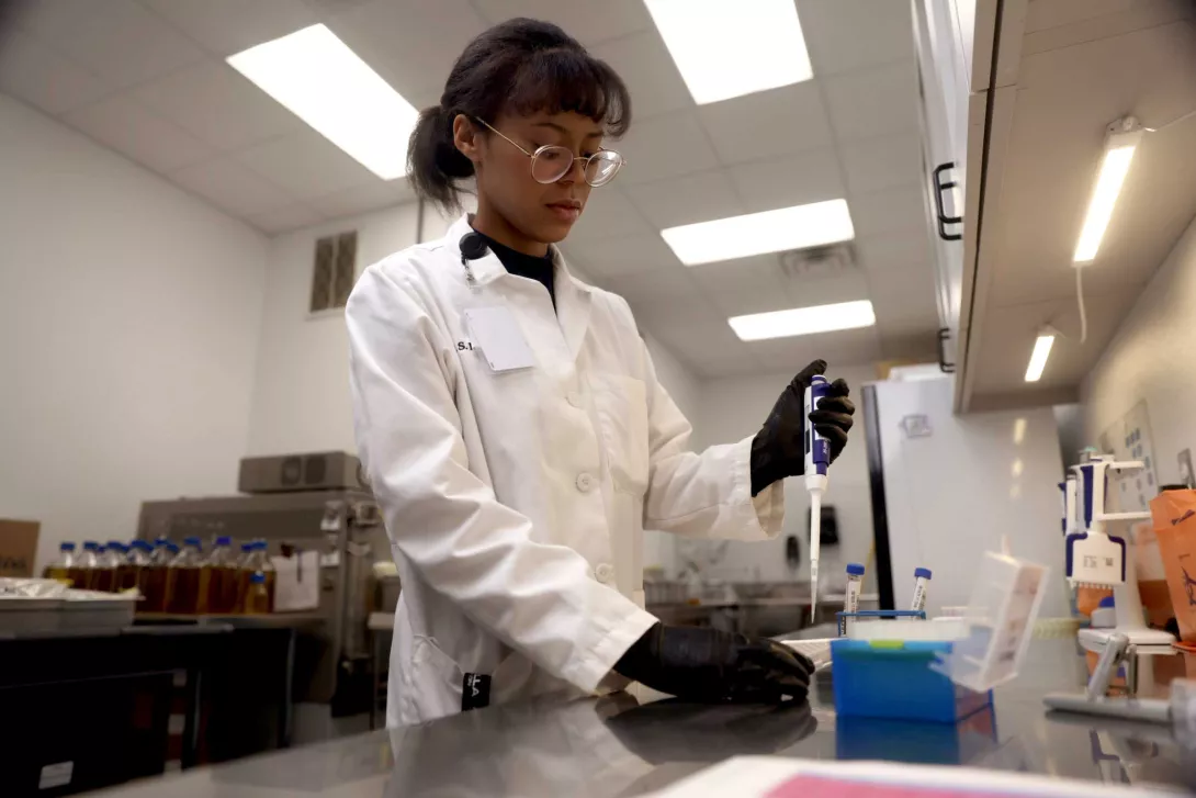 tfp scientist working with lab equipment
