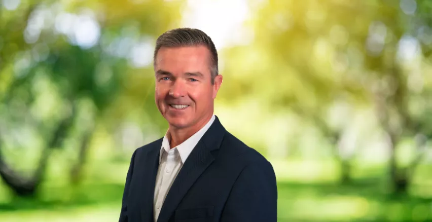 man in suit with nature background